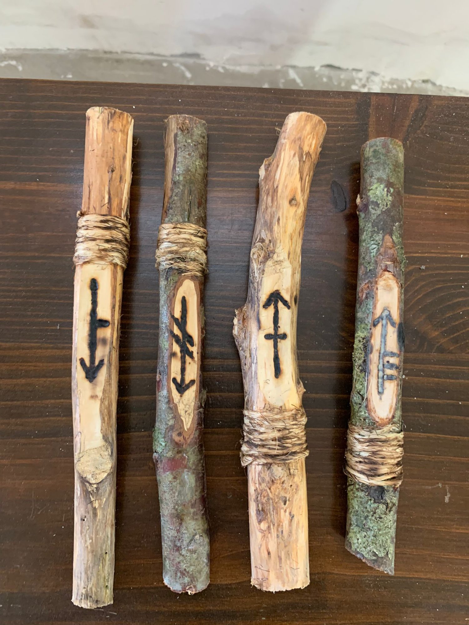 Four staffs carved with symbols, puzzle components
