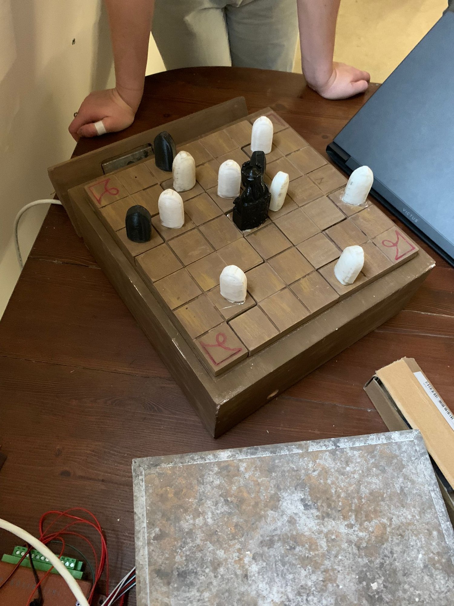 The game board and its pieces, before being built into the set