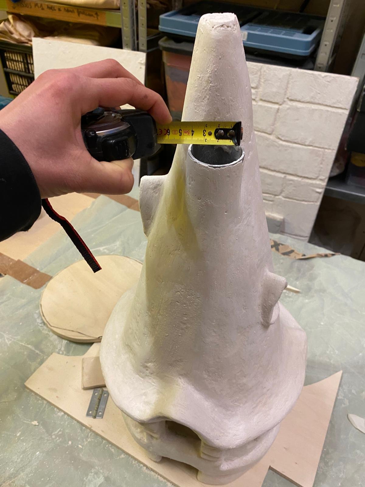 Rapunzel's tower being sculpted in the workshop, dimensions checked by hand