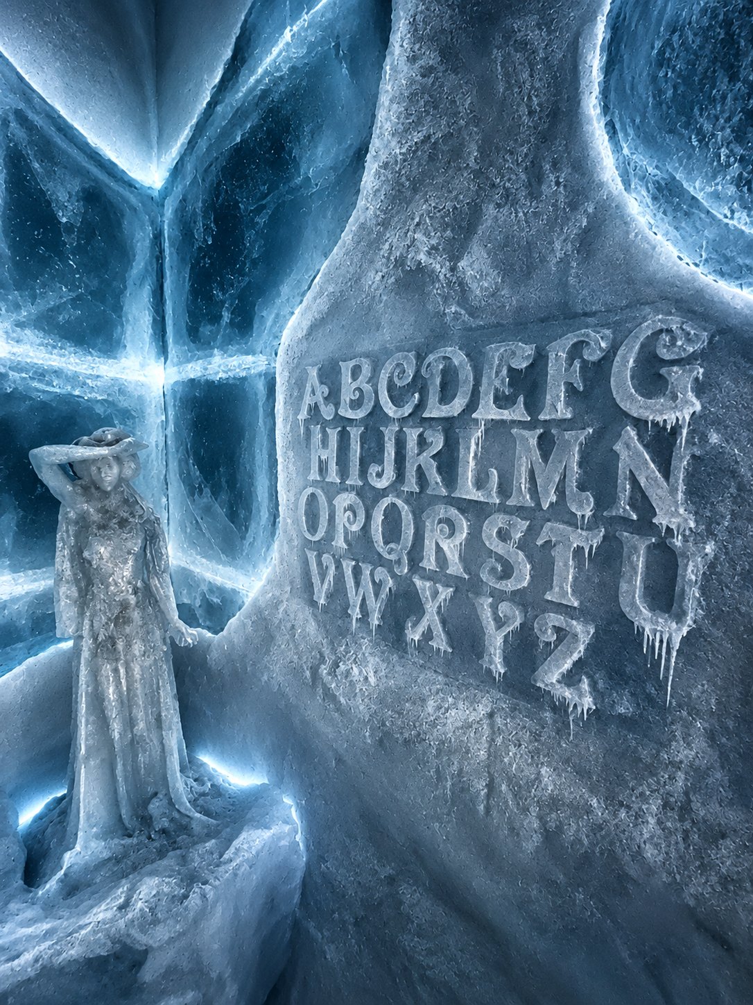 The ice statue before the alphabet carved into the wall, part of a puzzle