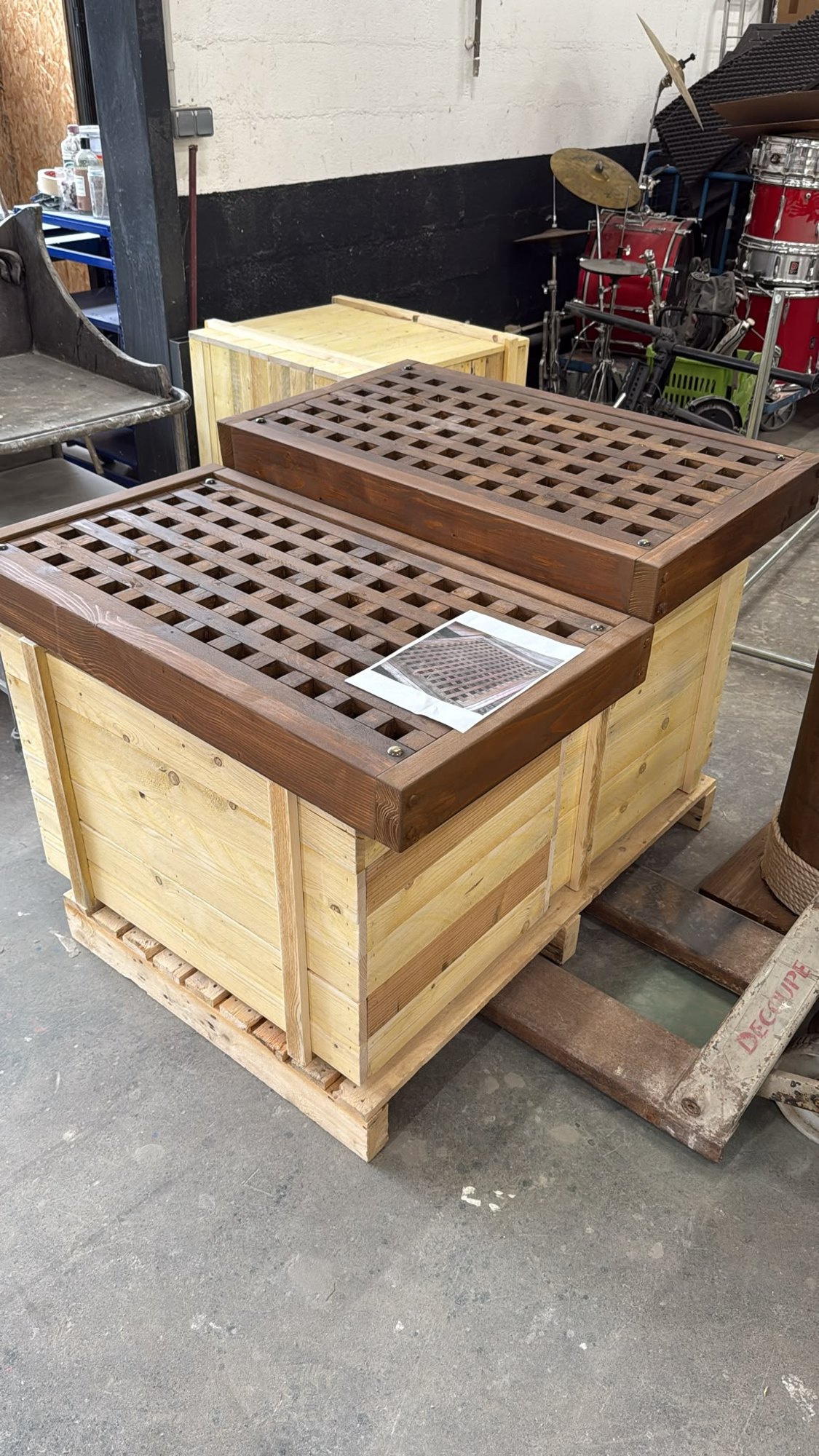 Two slatted chests, one aged, the other still bare