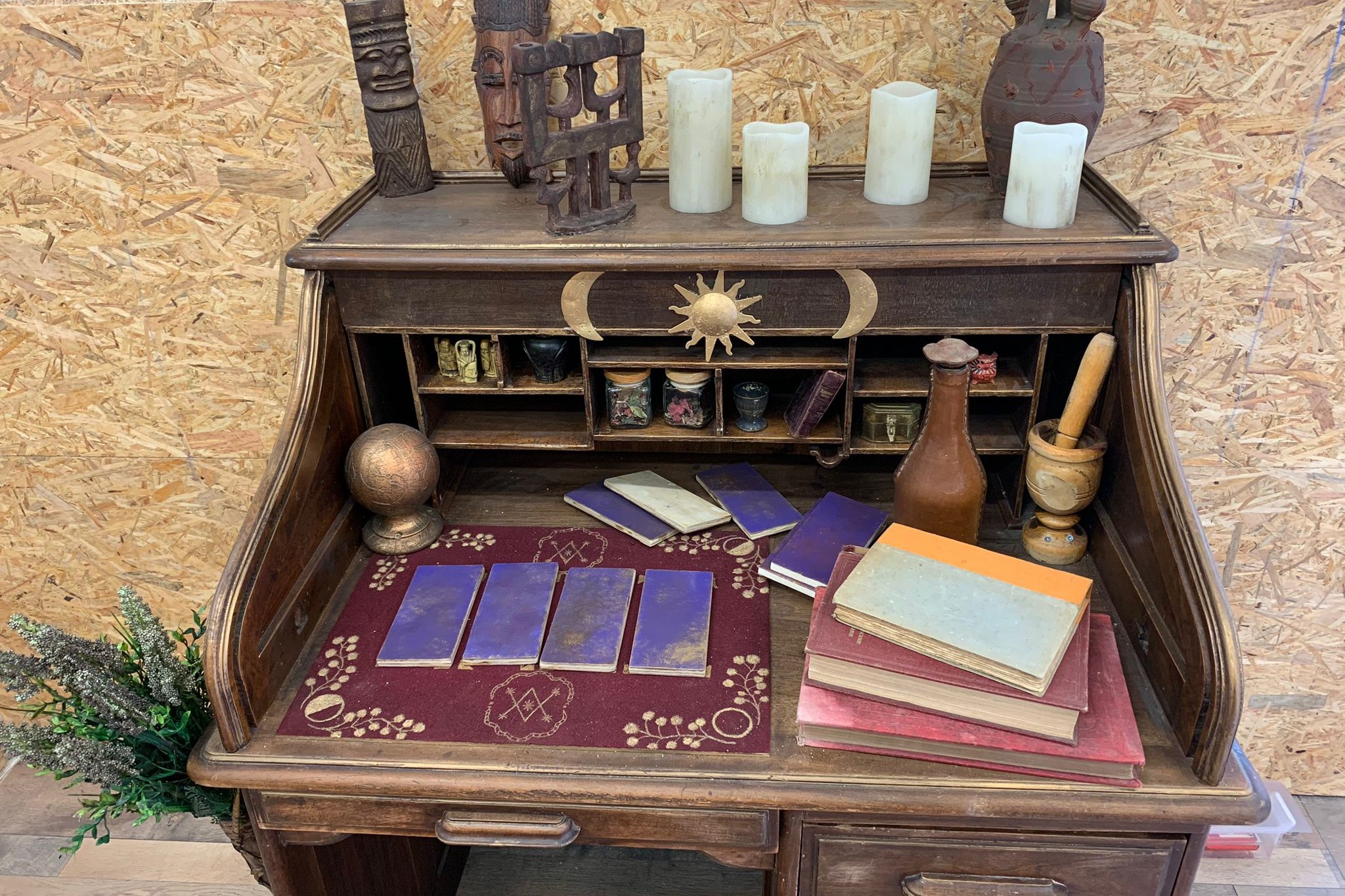 Writing desk with candles, cards and clues, set of a Mytho-Logique room in Montpellier